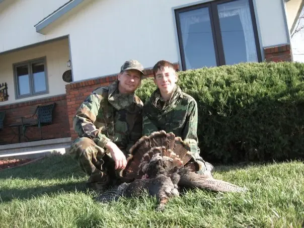Marcus with his Dad on a turkey hunt in Kansas